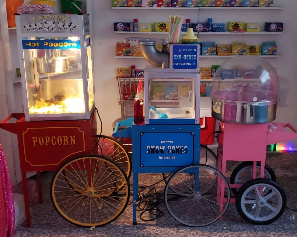 Popcorn, snow cone and cotton candy carts together
