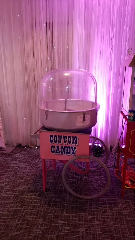 Cotton candy cart under pink lights